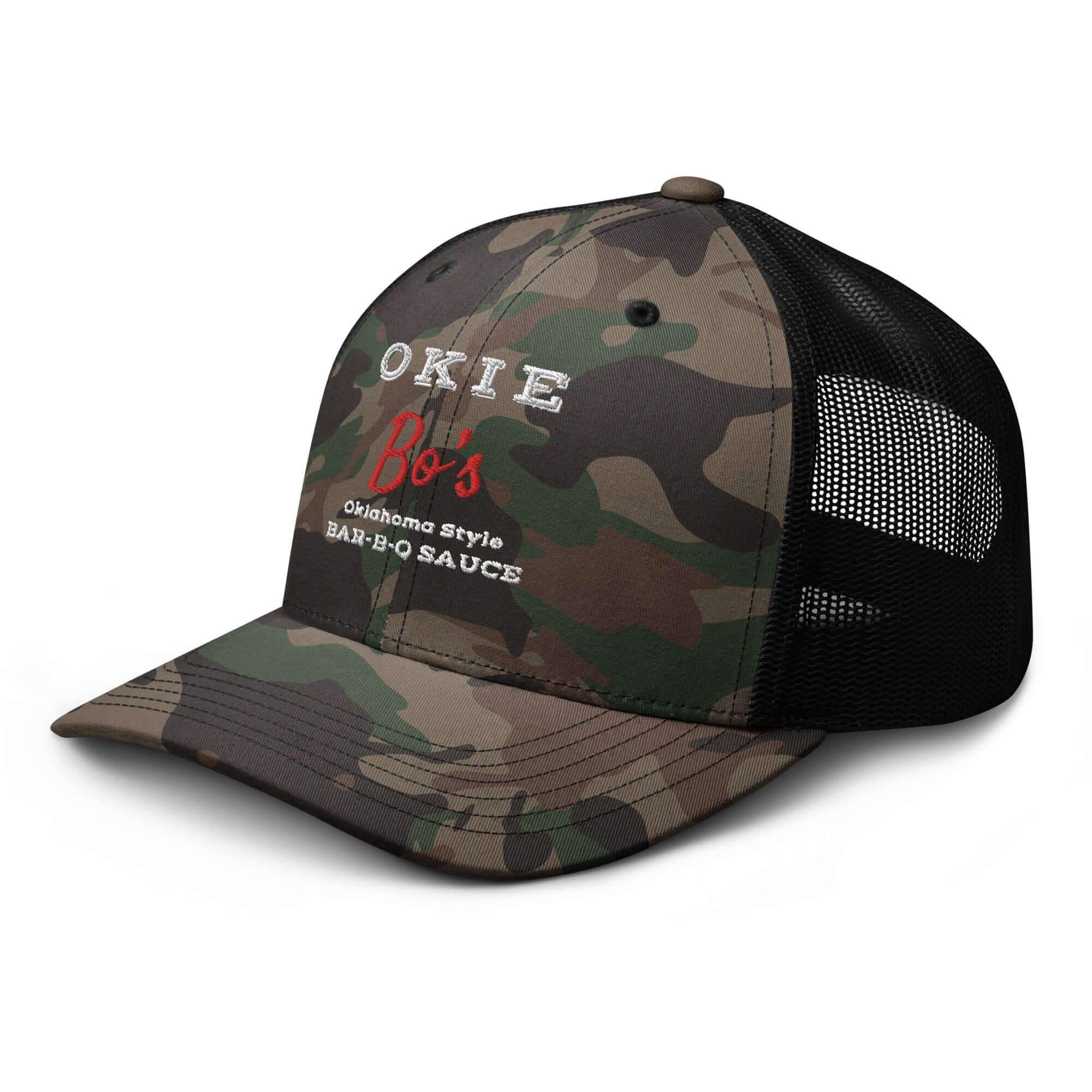 Okie Bo's Sauce camo trucker hat with embroidered logo and black mesh back angled view